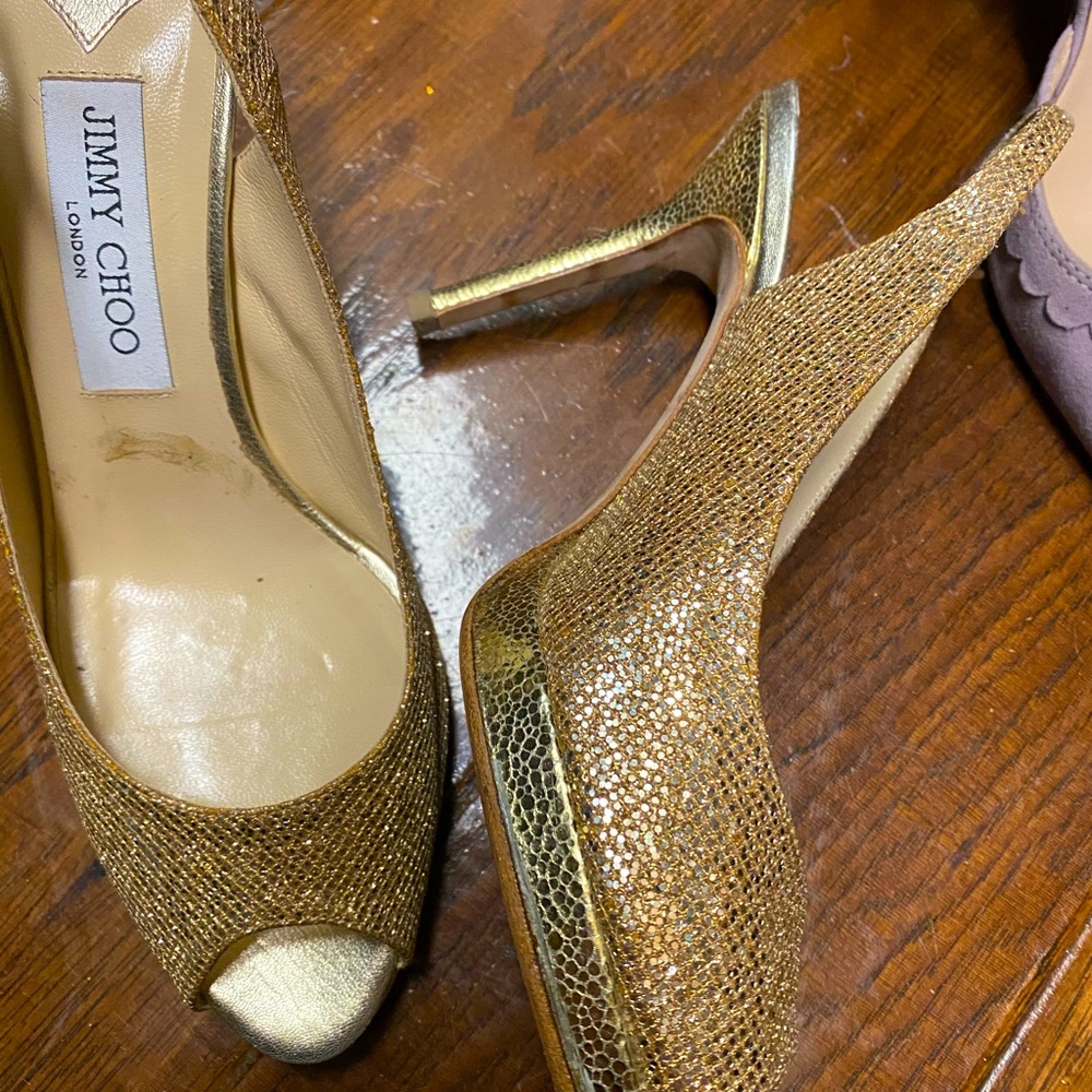 Jimmy choo heels, sling back, gold color.  Nice condition